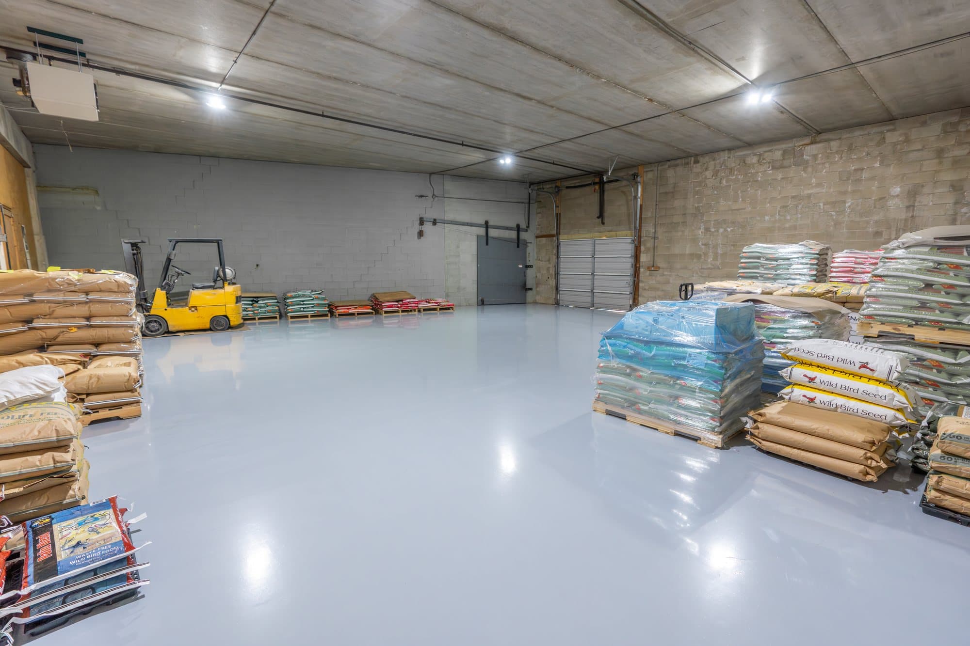 Heavy-duty coated concrete floor in a feed warehouse